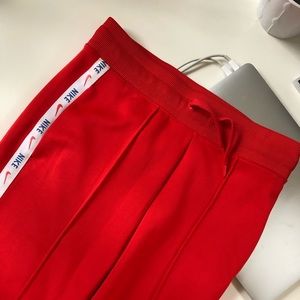 Nike track pants with stripe